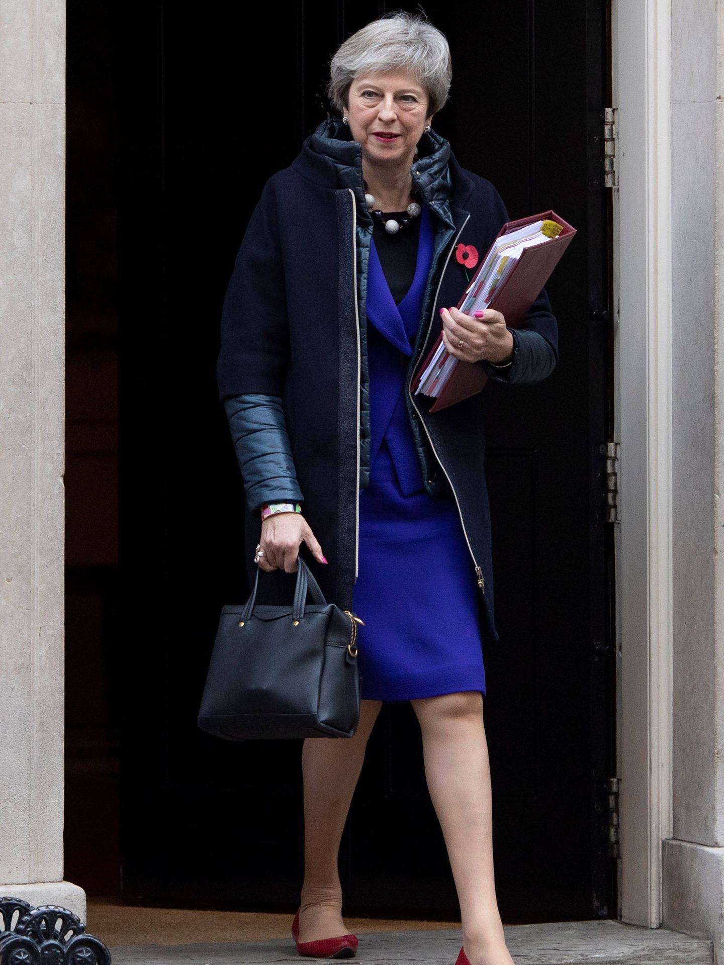  Theresa May con el abrigo de la discordia. (EFE)