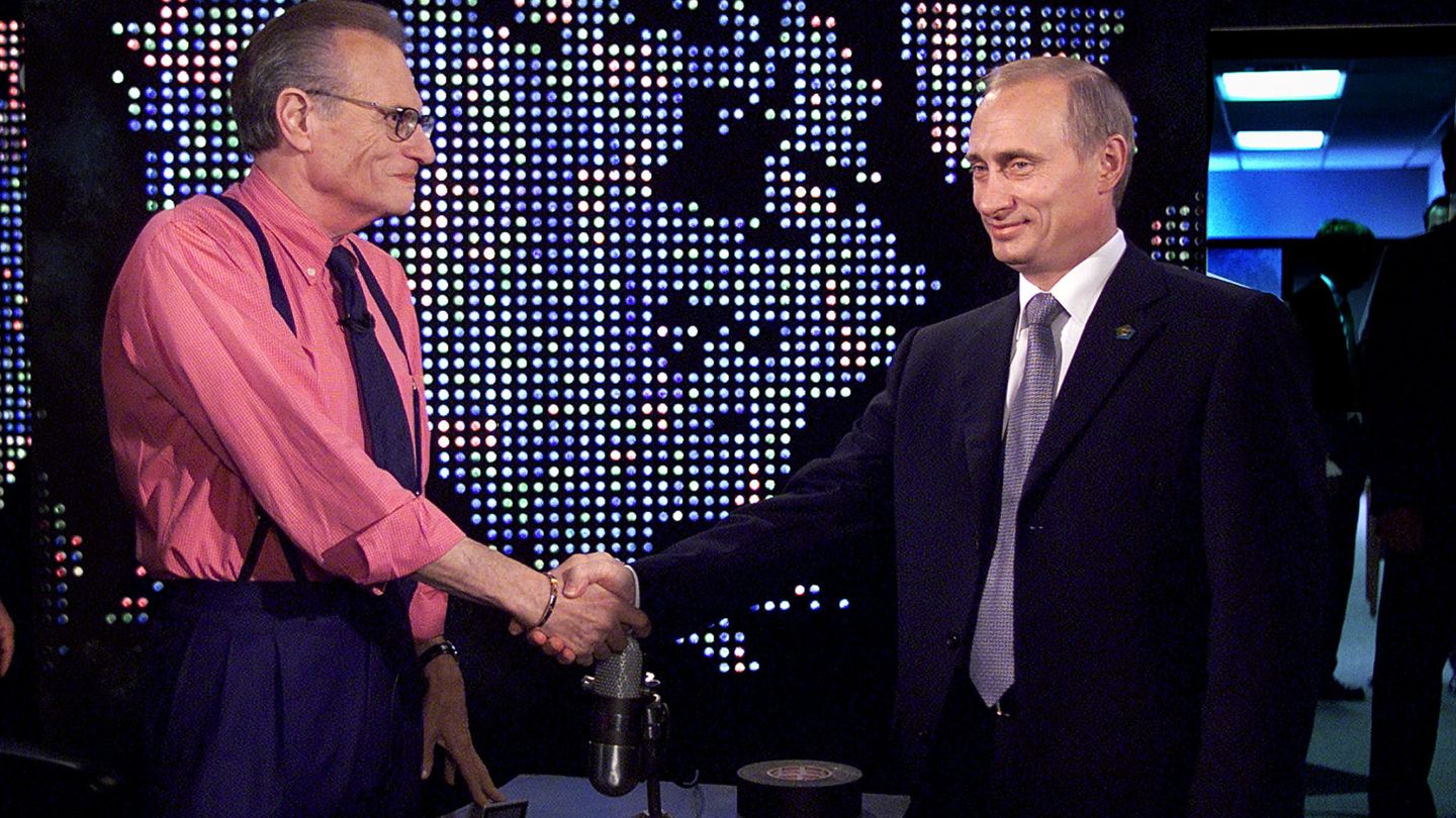 FILE PHOTO: Russian President Vladimir Putin shakes hands with Larry King before a taping of 'The Larry King Show' in New York City, U.S., September 8, 2000. REUTERS Brendan McDermid File Photo