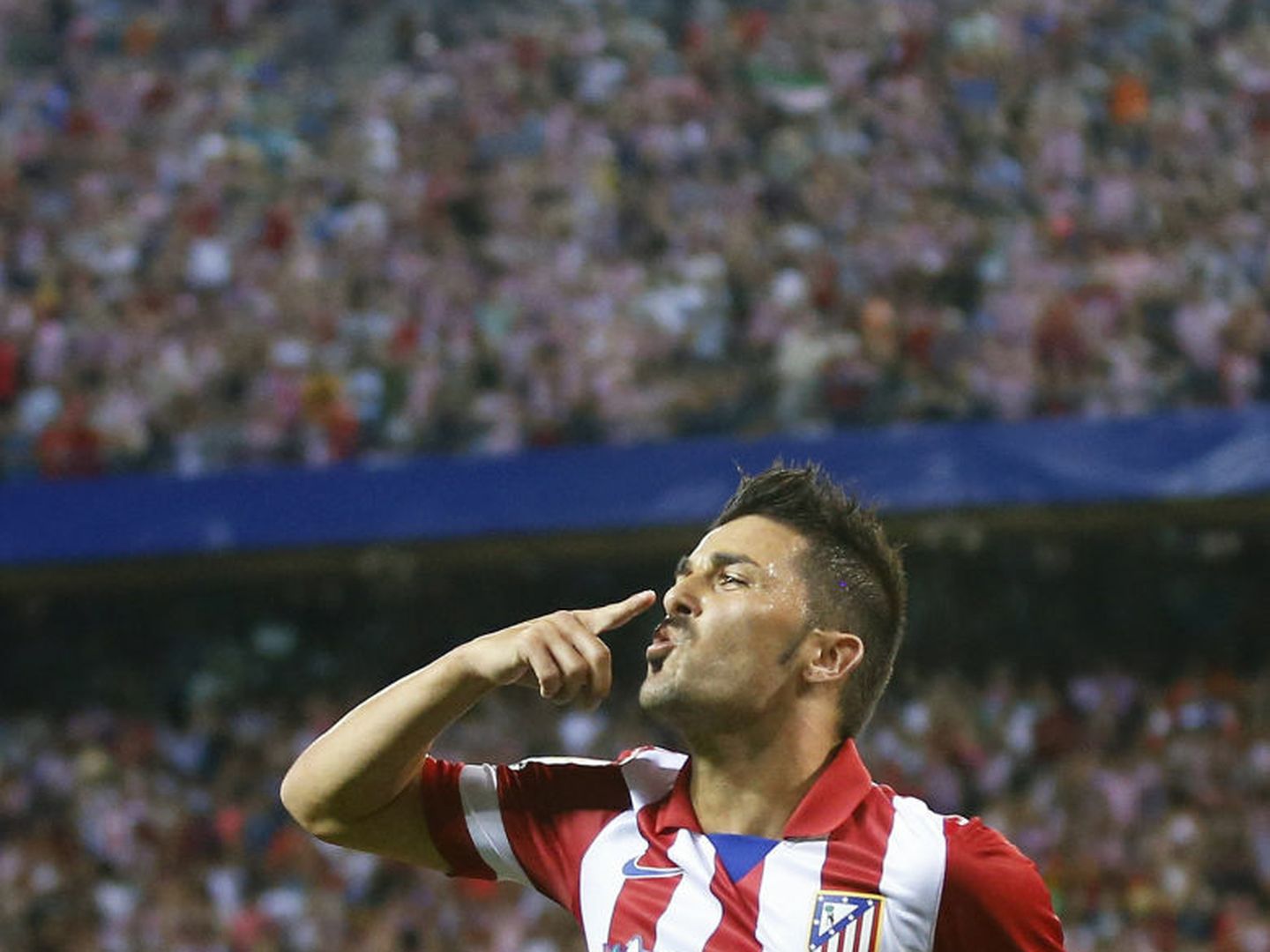 Atletico madrid's david villa celebrates his goal during their spanish supercup first leg soccer match against barcelona at the vicente calderon stadium in madrid