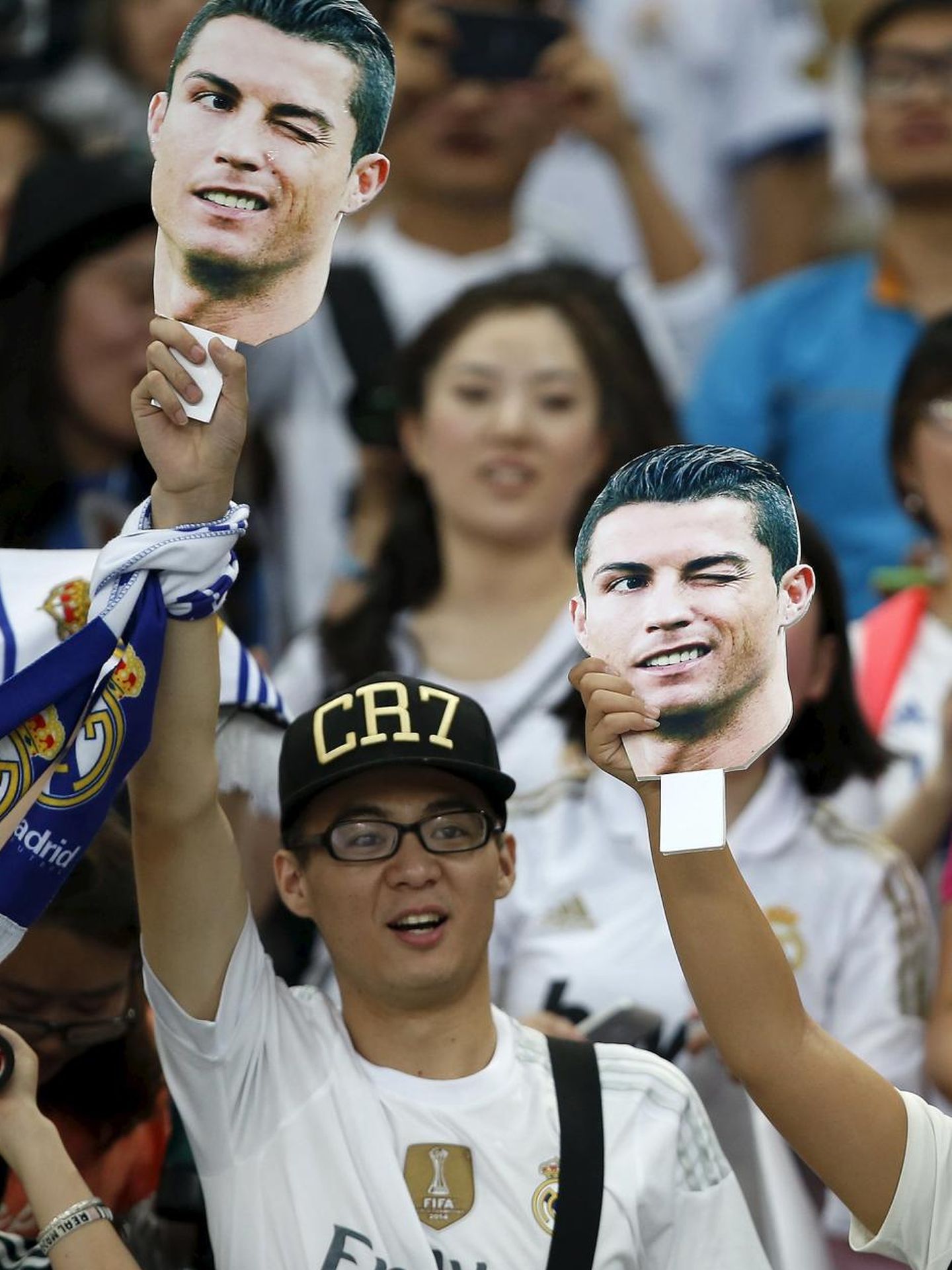 Fans of Real Madrid reacts during a training session ahead of a friendly match against A.C. Milan in Shanghai