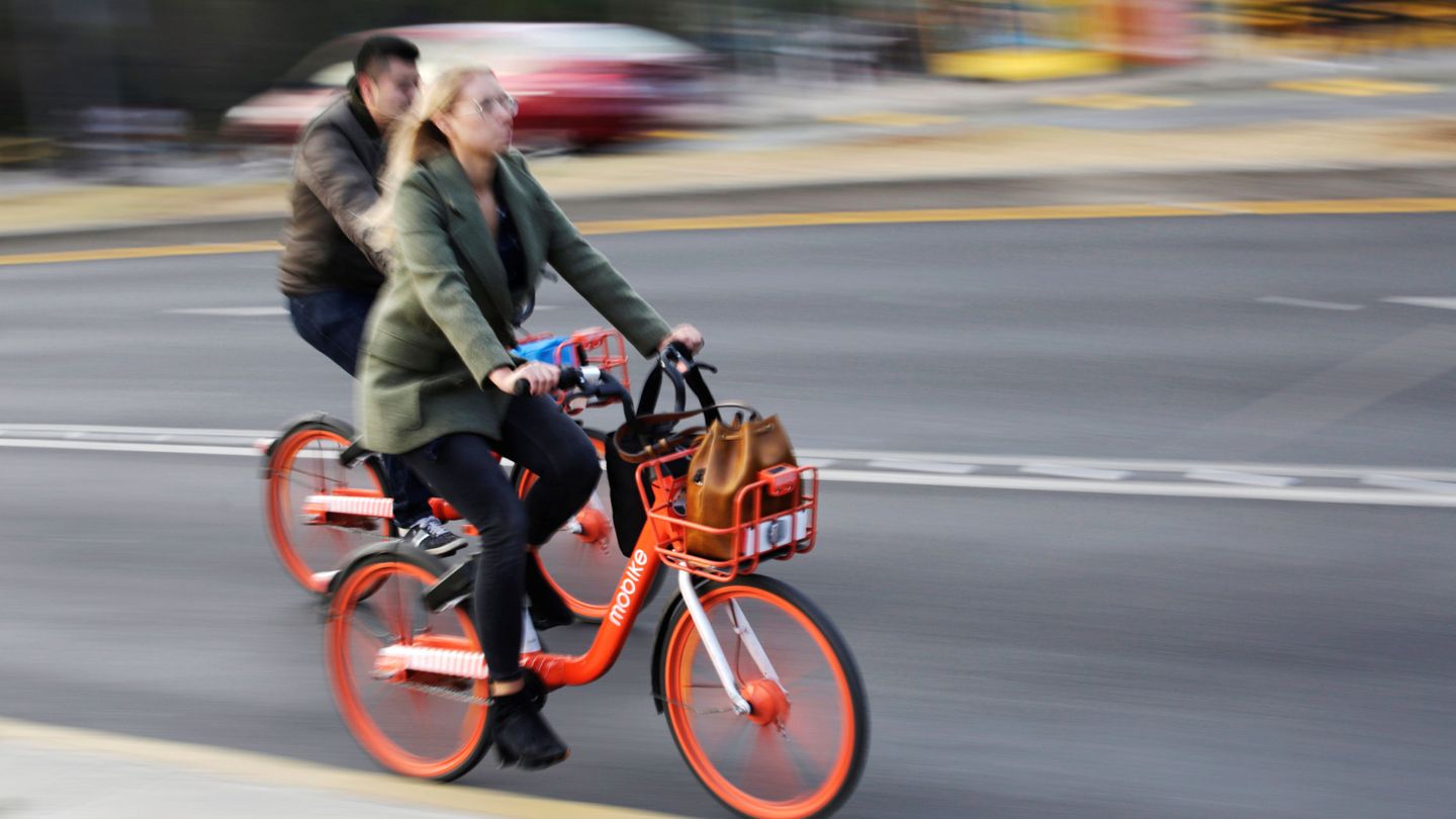 People ride bikes from Chinese bike-sharing company Mobike in Mexico City, Mexico January 10, 2019. REUTERS Daniel Becerril