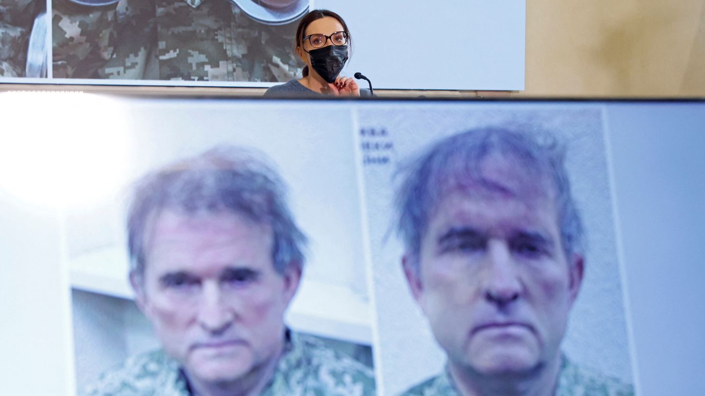 Oksana Marchenko, wife of pro-Russian Ukrainian politician Viktor Medvedchuk who was detained in Ukraine, attends a news conference, while pictures of her husband are displayed on screens, in Moscow, Russia April 15, 2022. REUTERS Maxim Shemetov