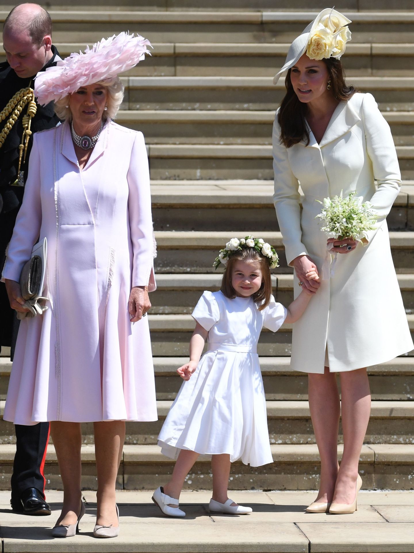 Kate Middleton, con su hija Charlotte (sin medias) en la boda de Meghan y Harry. (EFE)