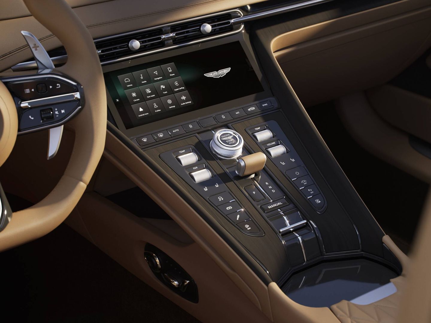 La pantalla táctil concentra muchas funciones, pero Aston Martin conserva también mandos tradicionales.