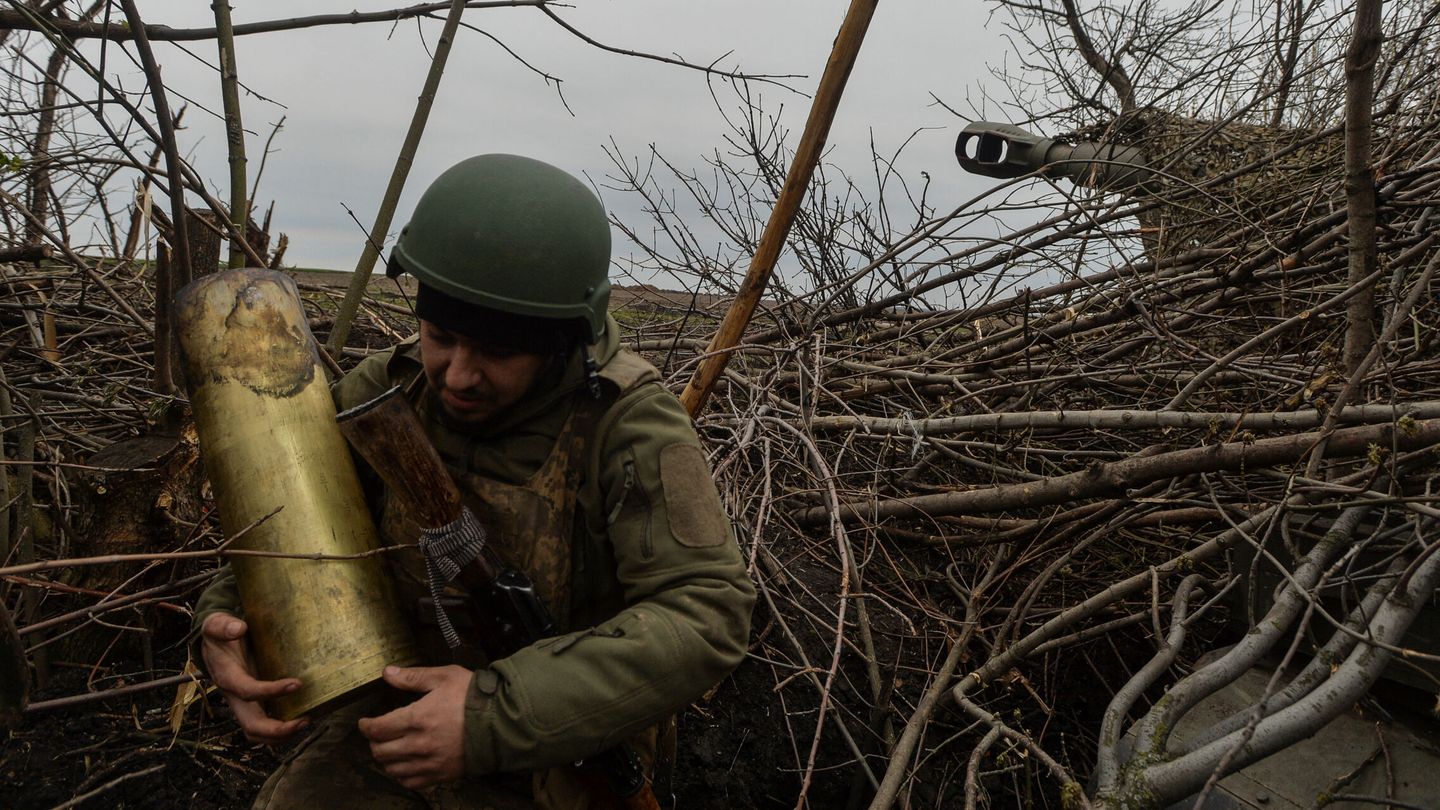 A Ukrainian serviceman carries a used shell for a 2S3 Akatsiia self-propelled howitzer after firing towards Russian troops near the frontline town of Bakhmut, amid Russia's attack on Ukraine, in Donetsk region, Ukraine April 12, 2023. REUTERS Oleksandr Klymenko