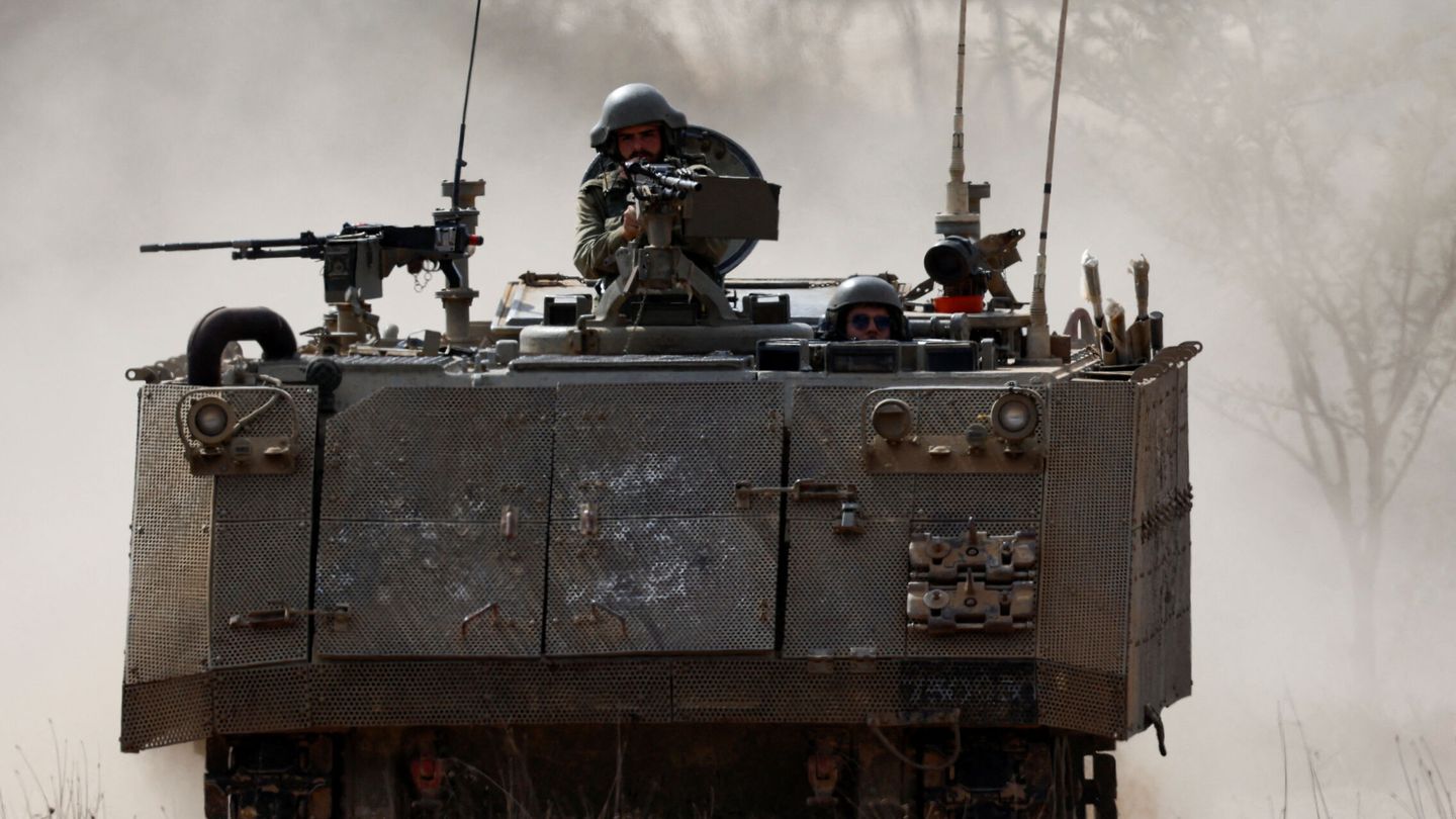 Israeli soldiers ride in an armoured personnel carrier (APC), amid the ongoing conflict between Israel and Hamas, near the border between Israel and Gaza Strip, in Israel, October 31, 2023. REUTERS Amir Cohen