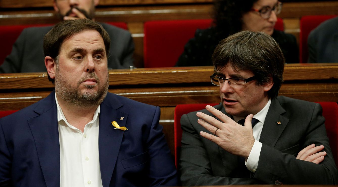 Carles Puigdemont y Oriol Junqueras. (Reuters)