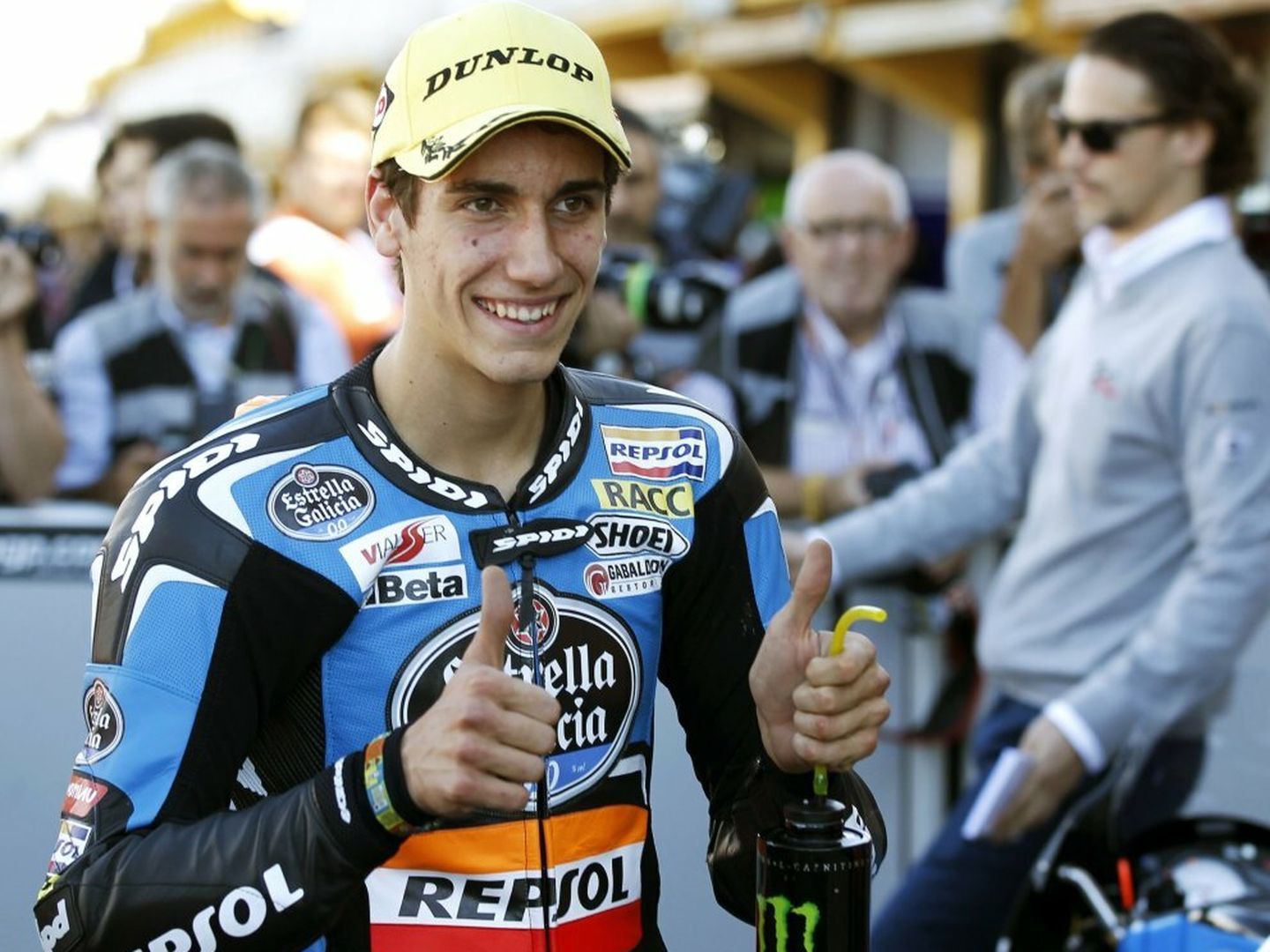 Ktm moto3 rider alex rins of spain gives thumbs-up after taking pole position ahead of the valencia motorcycle grand prix at the ricardo tormo racetrack in cheste