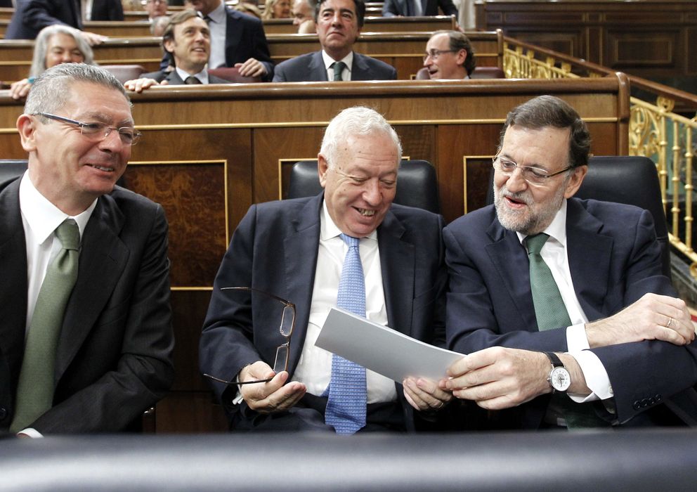 Foto: El ministro de Justicia, Alberto Ruiz-Gallardón (i), el ministro de Asuntos Exteriores, José Manuel García-Margallo (c), y el presidente del Gobierno, Mariano R