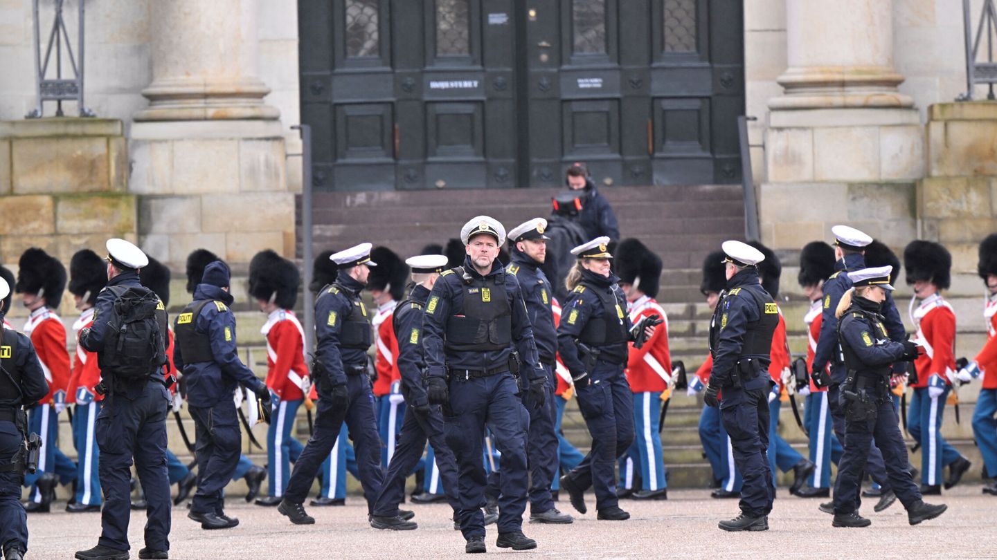 Police officers and members of the Royal Life Guards walk at the Christiansborg Palace Square, on the day Denmark's Queen Margrethe abdicates after a reign of 52 years and her elder son, Crown Prince Frederik, ascends the throne as King Frederik X in Copenhagen, Denmark, January 14, 2024. Ritzau Scanpix Nils Meilvang via REUTERS    ATTENTION EDITORS - THIS IMAGE WAS PROVIDED BY A THIRD PARTY. DENMARK OUT. NO COMMERCIAL OR EDITORIAL SALES IN DENMARK.