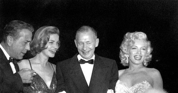 Foto: Humphrey Bogart, Lauren Bacall, Nunnally Johnson y Marilyn Monroe en la premiere de 'Cómo casarse con un millonario'. 