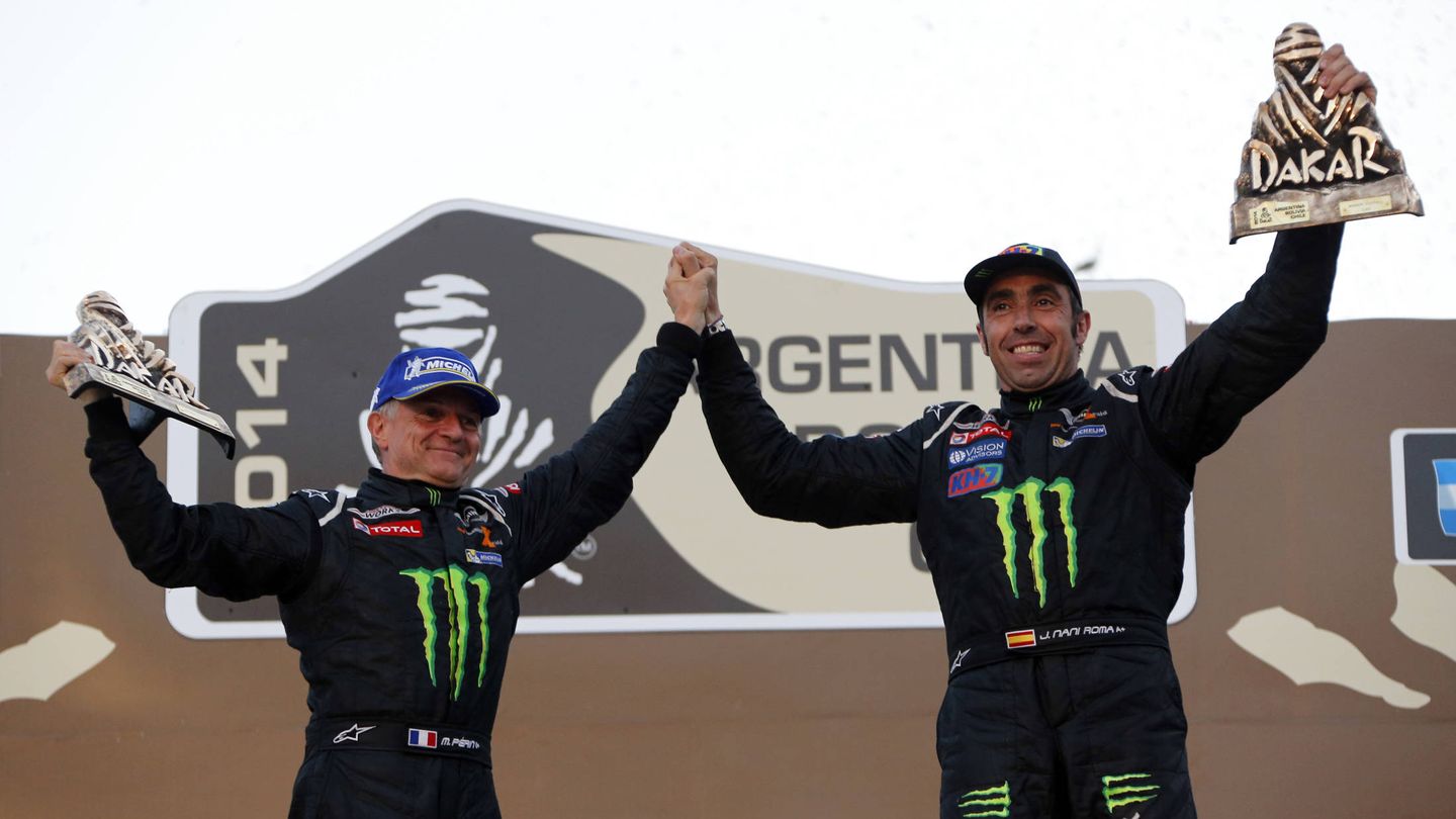 Nani Roma of Spain (R) and co-driver Michel Perin of France celebrate on the podium after winning the sixth South American edition of the Dakar rally 2014 in the car category in Valparaiso city, about 121 km (75 miles) northwest of Santiago, January 18, 2014. REUTERS/Jean-Paul Pelissier (CHILE  - Tags: SPORT MOTORSPORT) - GM1EA1J0PL701