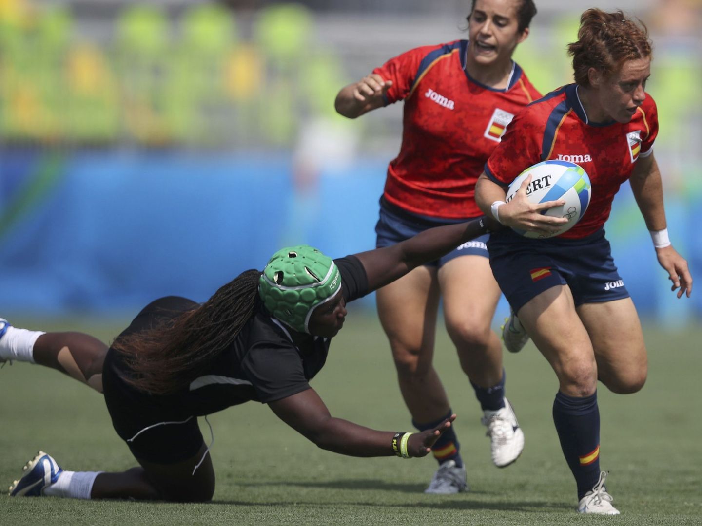 2016 Rio Olympics - Rugby - Preliminary - Women's Pool B Spain v Kenya - Deodoro Stadium - Rio de Janeiro, Brazil - 07 08 2016. Barbara Pla (ESP) of Spain is tackled by Philadelphia Olando (KEN) of Kenya.  REUTERS Phil Noble (BRAZIL  - Tags: SPORT OLYMPICS SPORT RUGBY) FOR EDITORIAL USE ONLY. NOT FOR SALE FOR MARKETING OR ADVERTISING CAMPAIGNS.