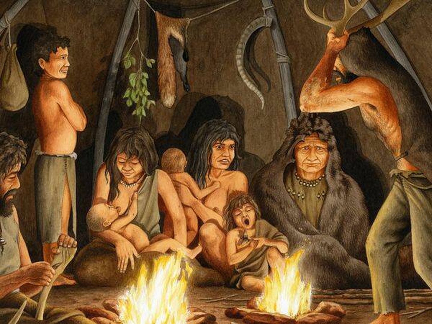 Ilustración de hombres primitivos en una cueva. 