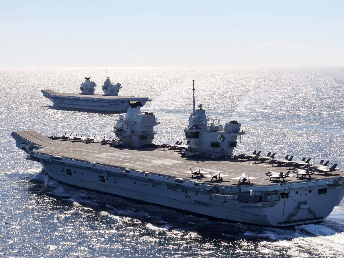 Photo: The first screen meeting of HMS Queen Elizabeth (foreground) and HMS Prince of Wales (background).  (Royal Navy)