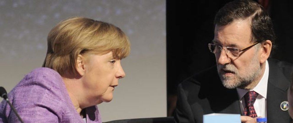 Foto: Merkel y Rajoy liman diferencias en privado tras airearlas en los medios