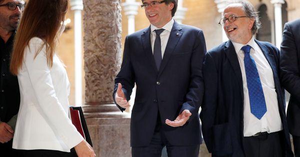 Foto: Carles Puigdemont junto a Carles McCragh. (EFE)