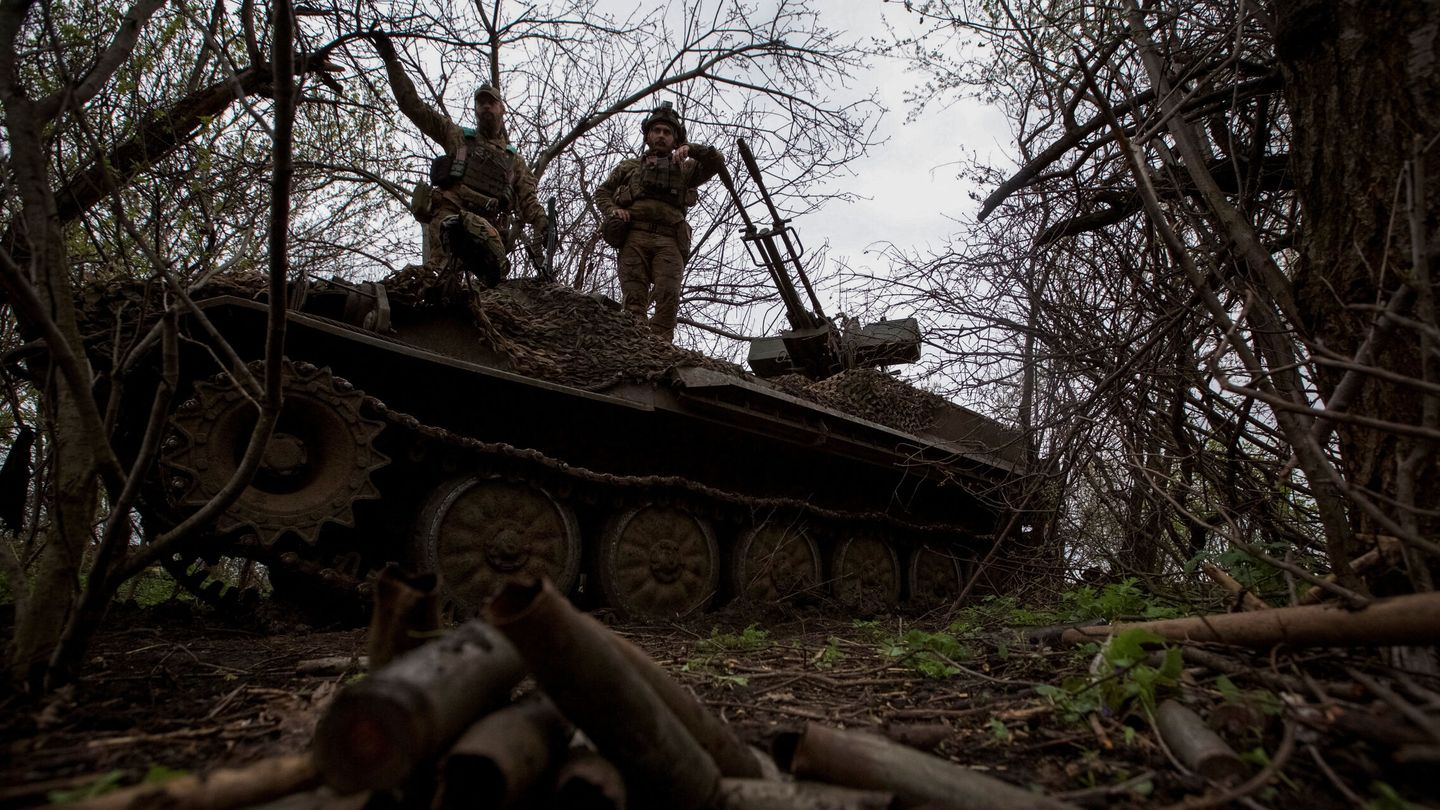 Ukrainian servicemen stand atop a military vehicle at their position, amid Russia's attack on Ukraine, near the frontline town of Bakhmut, Ukraine April 12, 2023.  REUTERS Anna Kudriavtseva