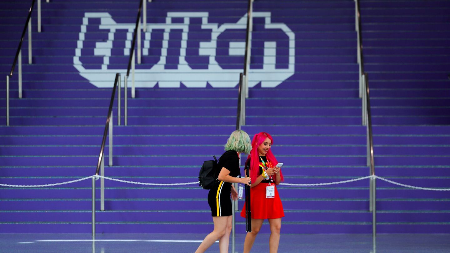 FILE PHOTO: Attendees walk past a Twitch logo painted on stairs during opening day of E3, the annual video games expo revealing the latest in gaming software and hardware in Los Angeles, California, U.S., June 11, 2019.  REUTERS Mike Blake File Photo