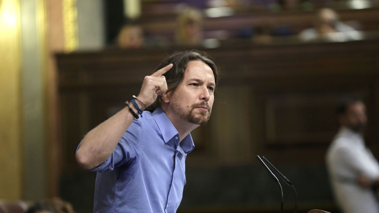 Foto: El secretario general de Podemos, Pablo Iglesias, responde al discurso del candidato del PP, Mariano Rajoy. (EFE)