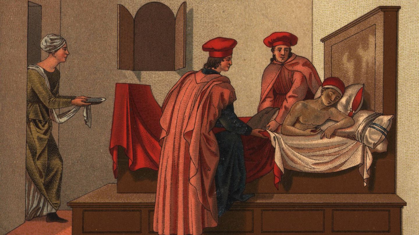 Dos hombres atienden a otro en la cama. Basado en la pintura de Francesco Pesellino. (Henry Guttmann Collection/Hulton Archive/Getty Images)