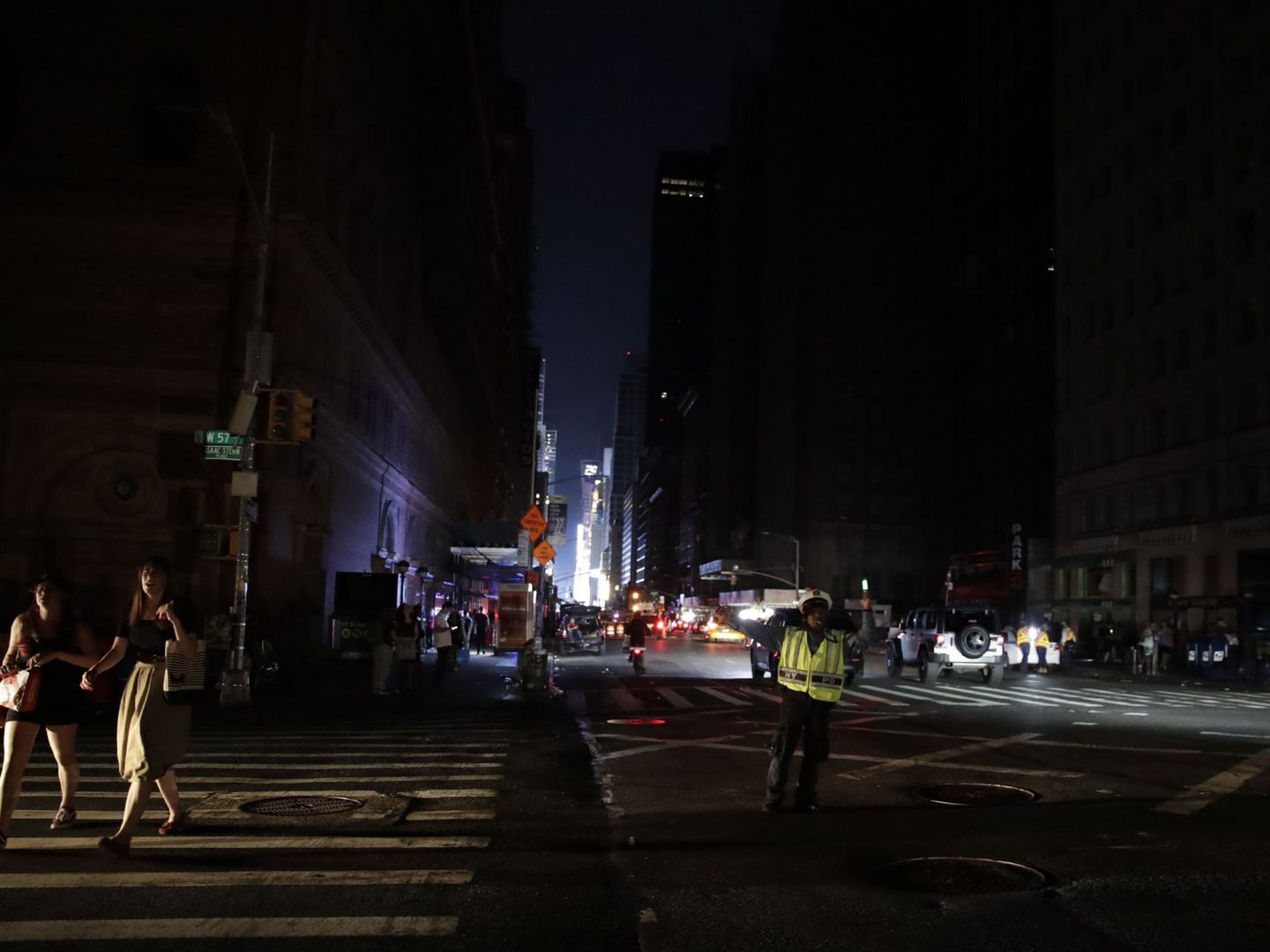 New York (United States), 14 07 2019.- People are seen walking on 7th Avenue near Carnagie Hall in Manhattan during a blackout in New York, USA, 13 July 2019. According to reports, an area suffered a blackout due to a transformer fire, trapping peopl