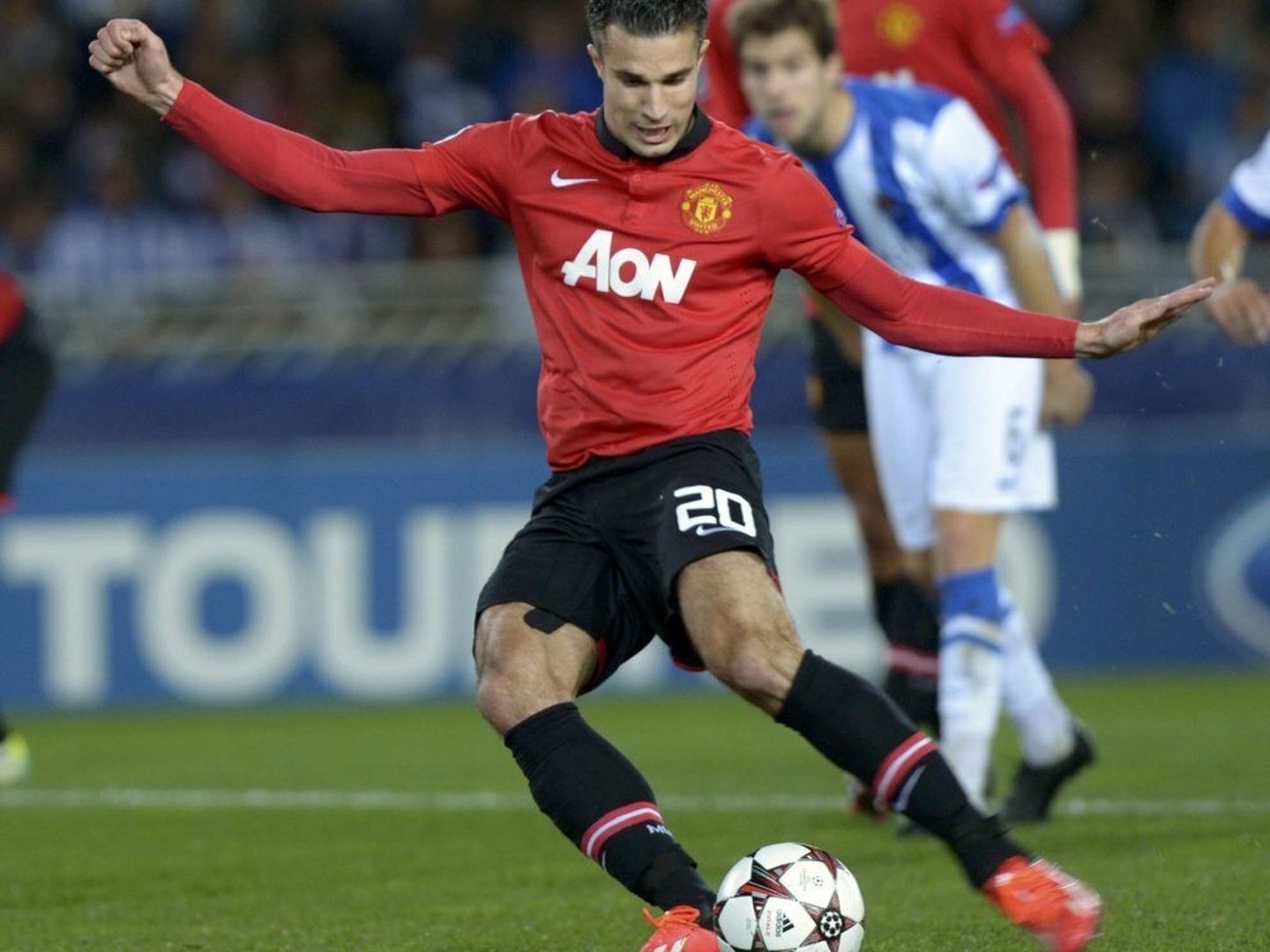 Manchester united's van persie kicks the ball to miss a penalty shot during their champions league soccer match against real sociedad in san sebastian