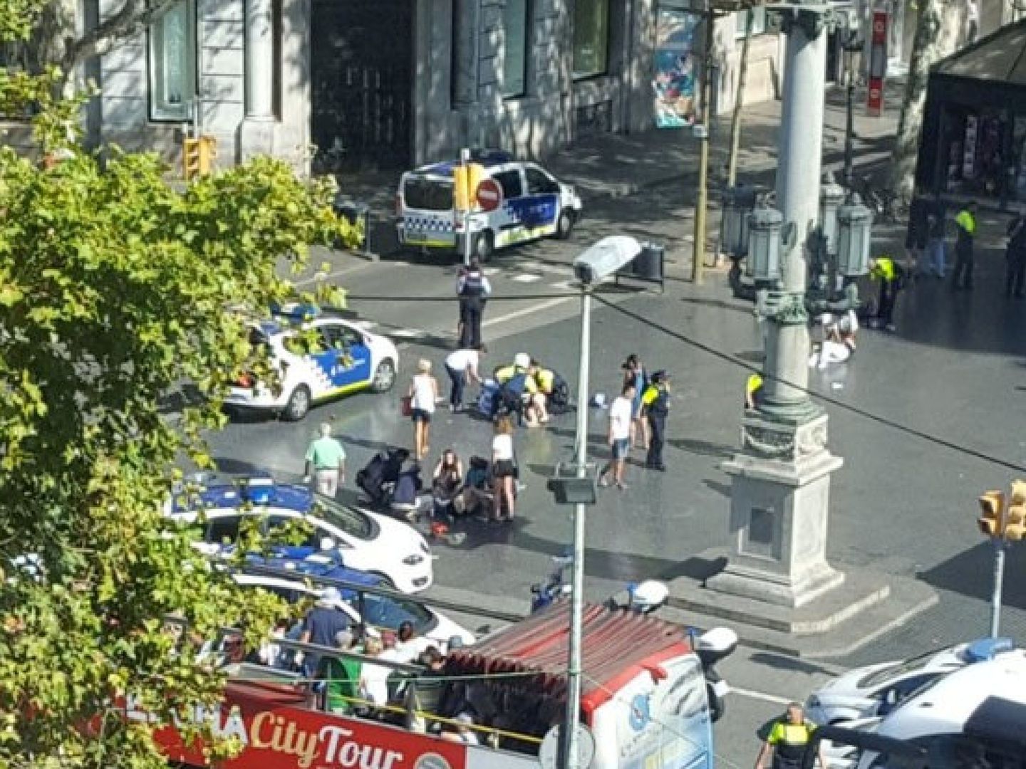 Police and emergency services attend to injured persons at the scene after a van crashed into pedestrians near the Las Ramblas avenue in central Barcelona, Spain August 17, 2017, in this still image from a video obtained from social media. Courtesy of  @Vil_Music via REUTERS ATTENTION EDITORS - THIS IMAGE HAS BEEN SUPPLIED BY A THIRD PARTY. NO RESALES. NO ARCHIVES. MANDATORY ON-SCREEN CREDIT.