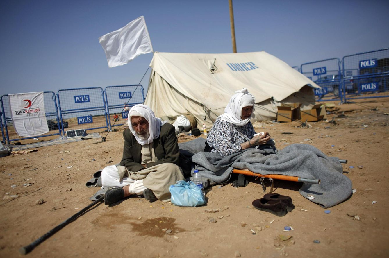 Refugiados sirios de Kobani en la frontera turca, en 2014 (Reuters)