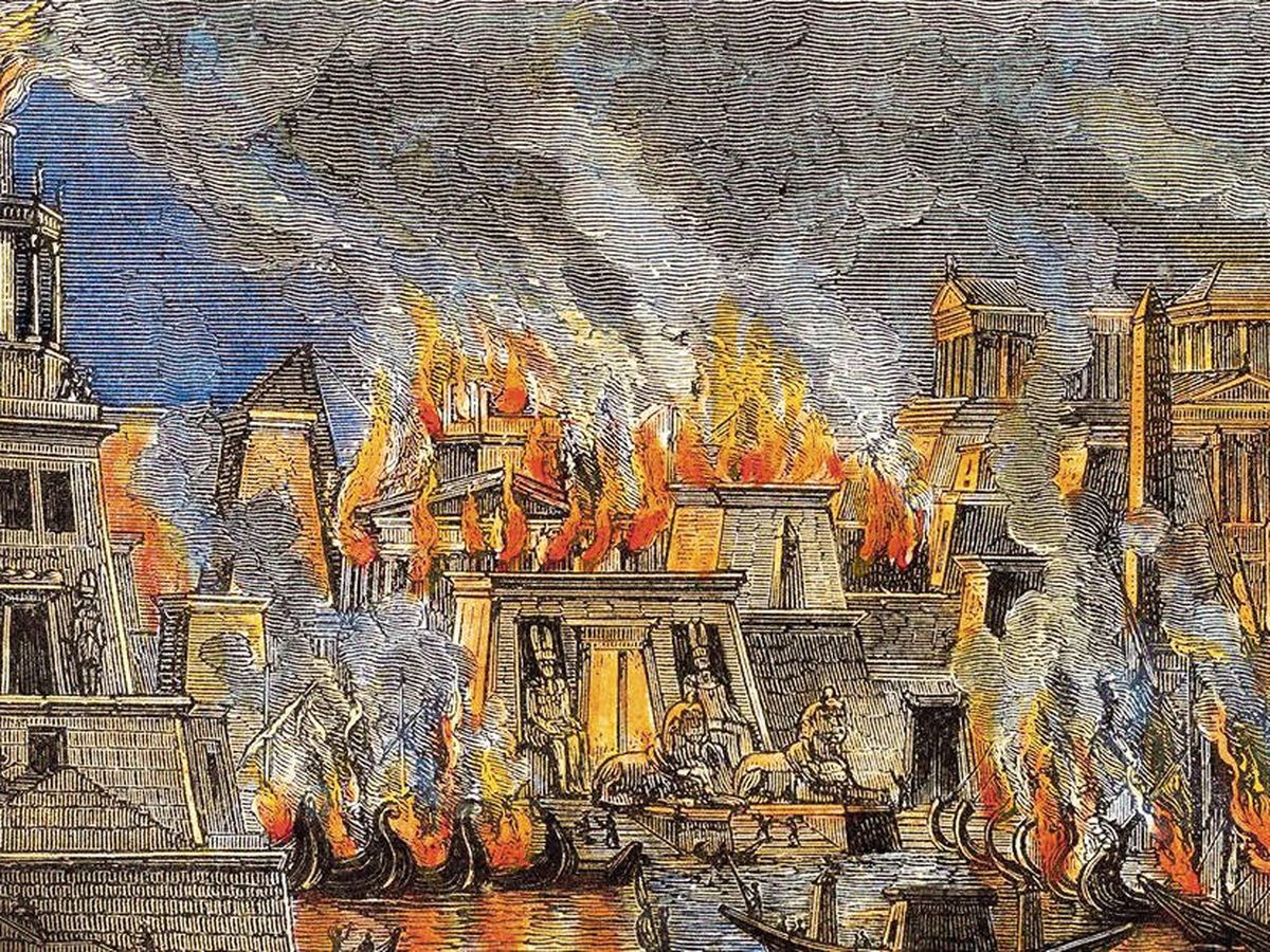 Foto: Grabado de 1876 que recrea el supuesto incendio que habría destruido parte de la Biblioteca de Alejandría en el 47 a.C.