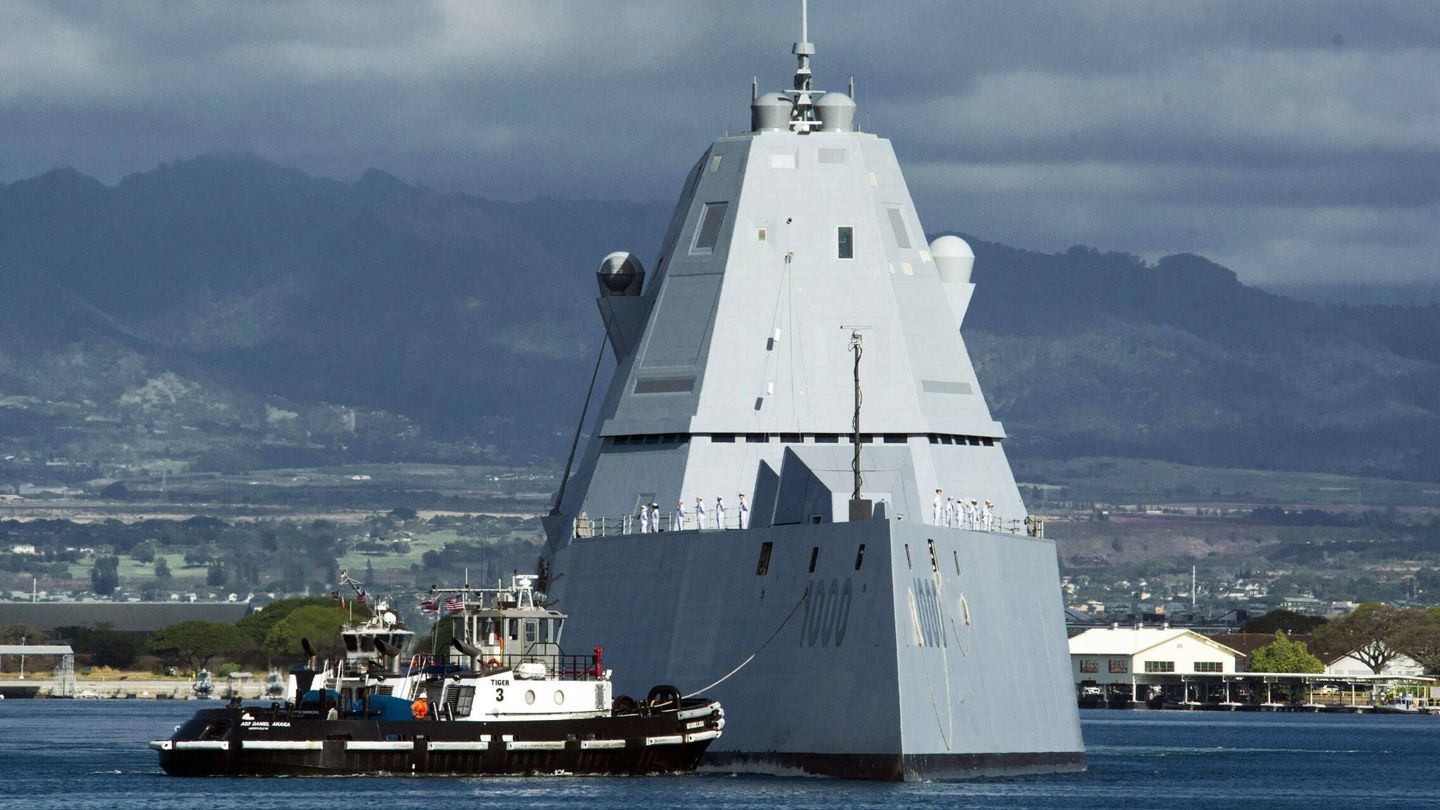 The lead ship of the U.S. Navy's newest class of guided-missile destroyers, the USS Zumwalt (DDG-1000), is assisted by a tugboat at Joint Base Pearl Harbor-Hickam on Tuesday, April 2, 2019, in Honolulu. The ship's arrival marks the first time Zumwalt has visited Pearl Harbor. (Craig T. Kojima/Honolulu Star-Advertiser via AP)