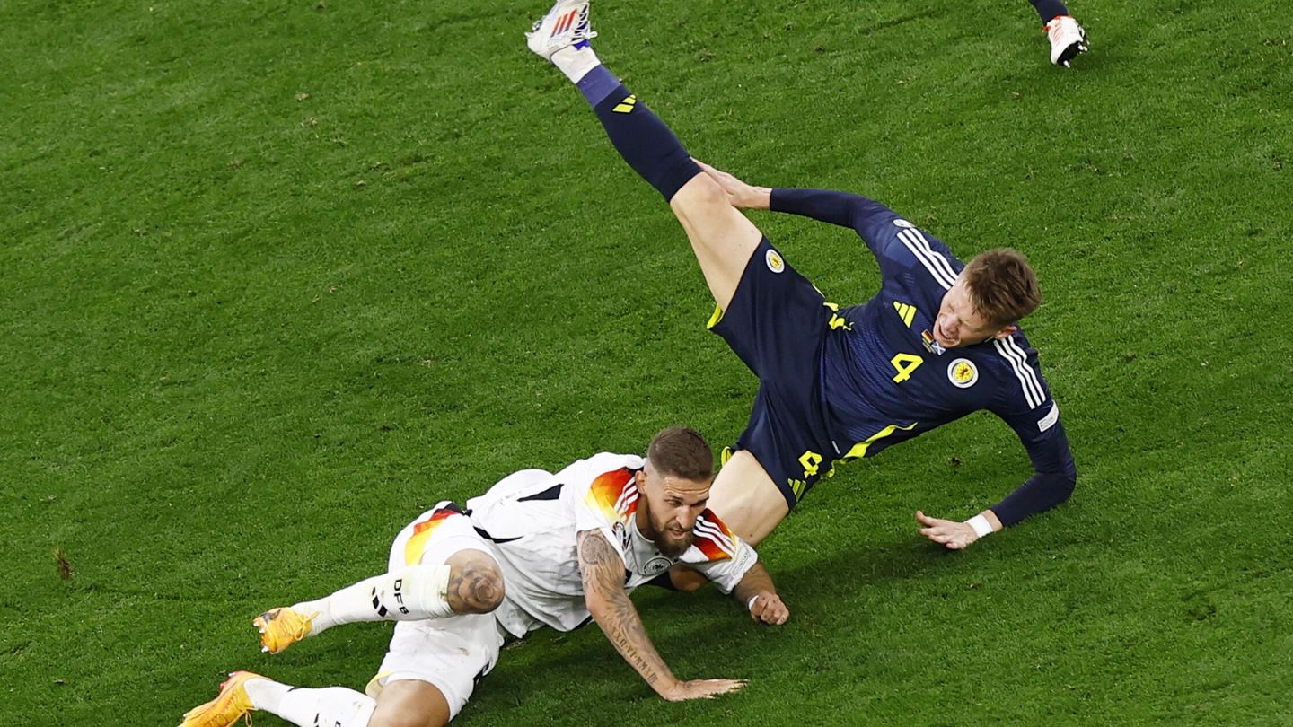 Soccer Football - Euro 2024 - Group A - Germany v Scotland - Munich Football Arena, Munich, Germany - June 14, 2024  Germany's Robert Andrich in action with Scotland's Scott McTominay REUTERS Michaela Stache