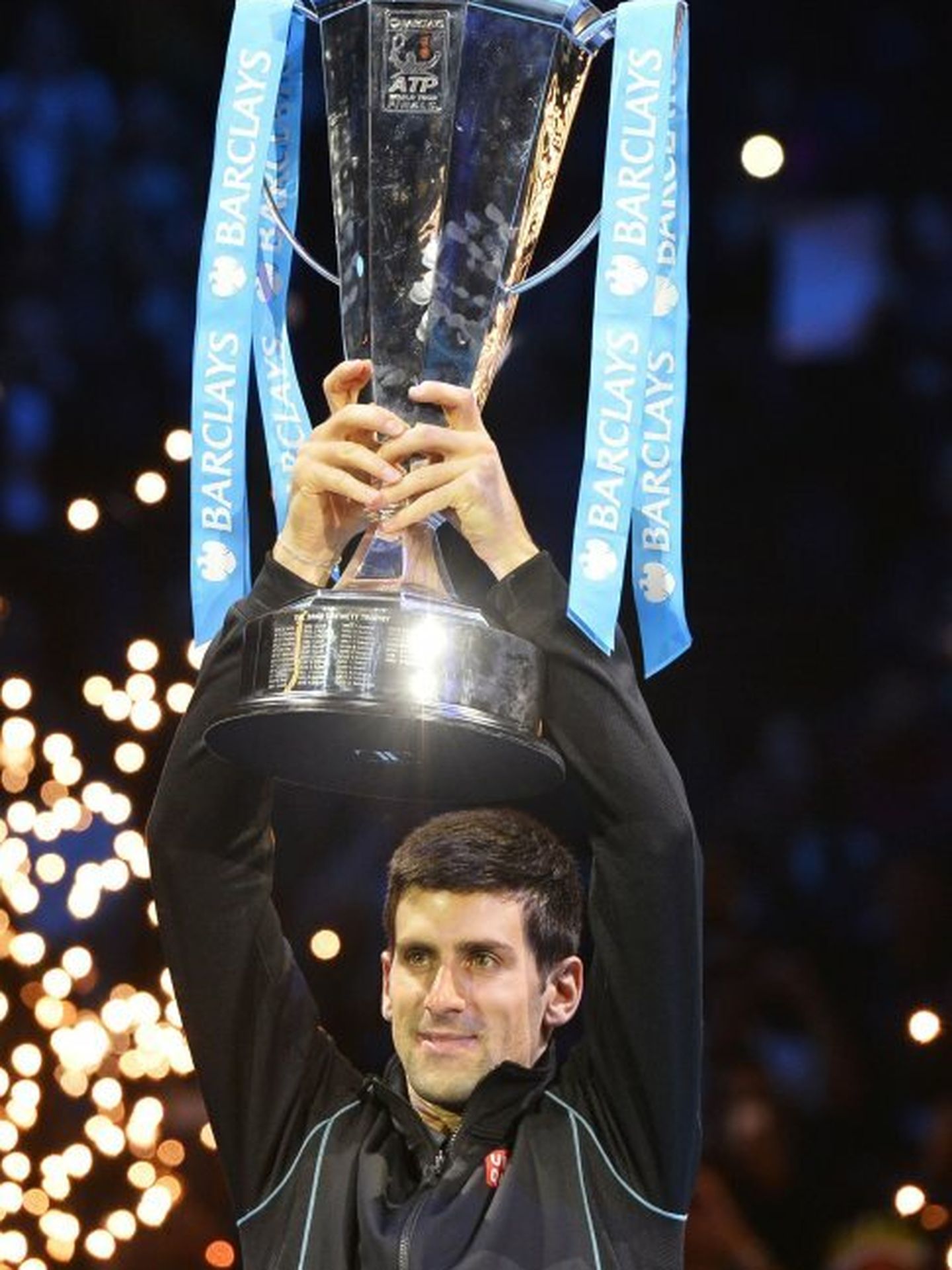 Djokovic of serbia raises the trophy after defeating nadal of spain in their men's final singles tennis match at the atp world tour finals in london