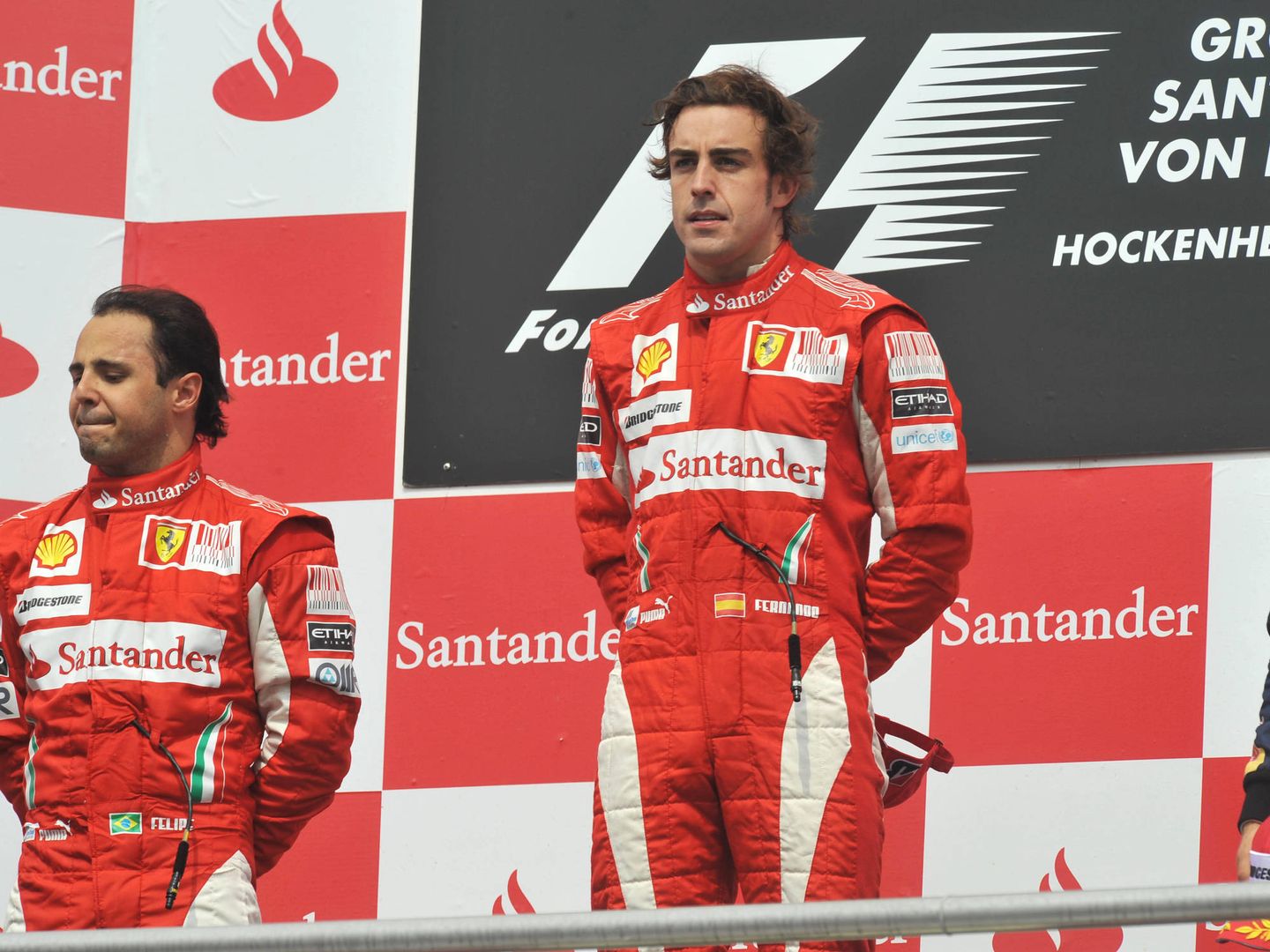 Alonso y Massa en el podio del GP de Alemania 2010. (Reuters)