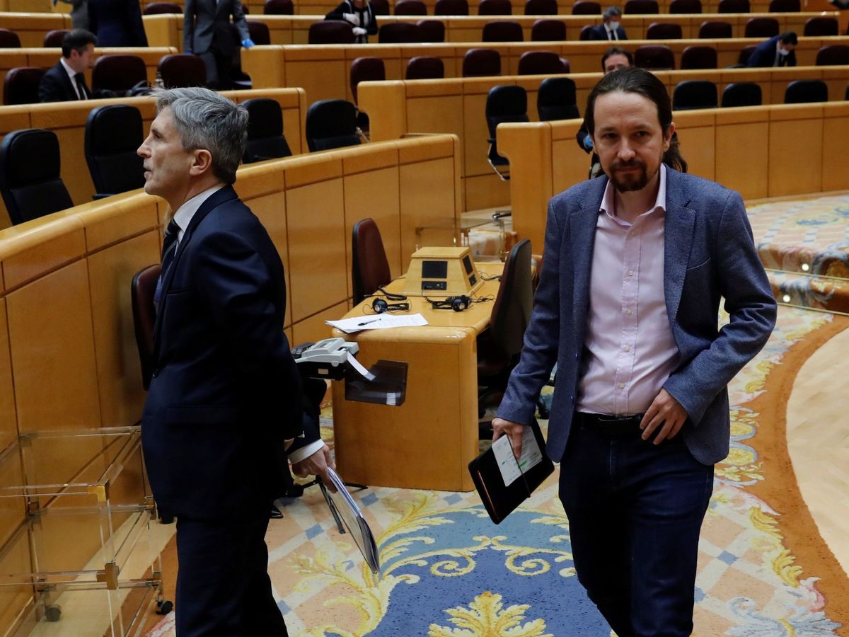 Foto: El ministro del Interior, Fernando Grande-Marlaska, y el líder de UP, Pablo Iglesias, en el Senado. (EFE)