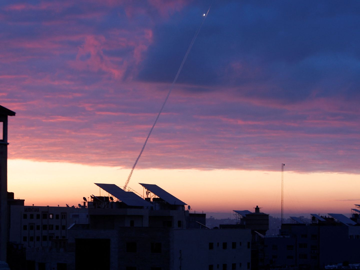 Trails of smoke are seen as rockets are fired from Gaza towards Israel during the sunrise, in Gaza City February 23, 2023. REUTERS Mohammed Salem