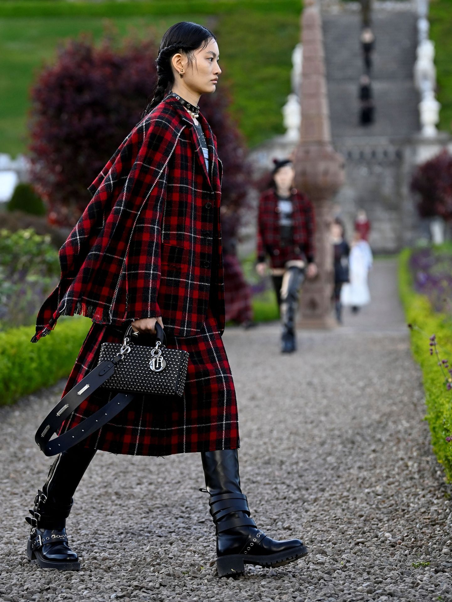 A model presents an outfit creation during a Christian Dior cruise show at Drummond castle, in Perthshire, Scotland, Britain June 3, 2024. REUTERS Lesley Martin