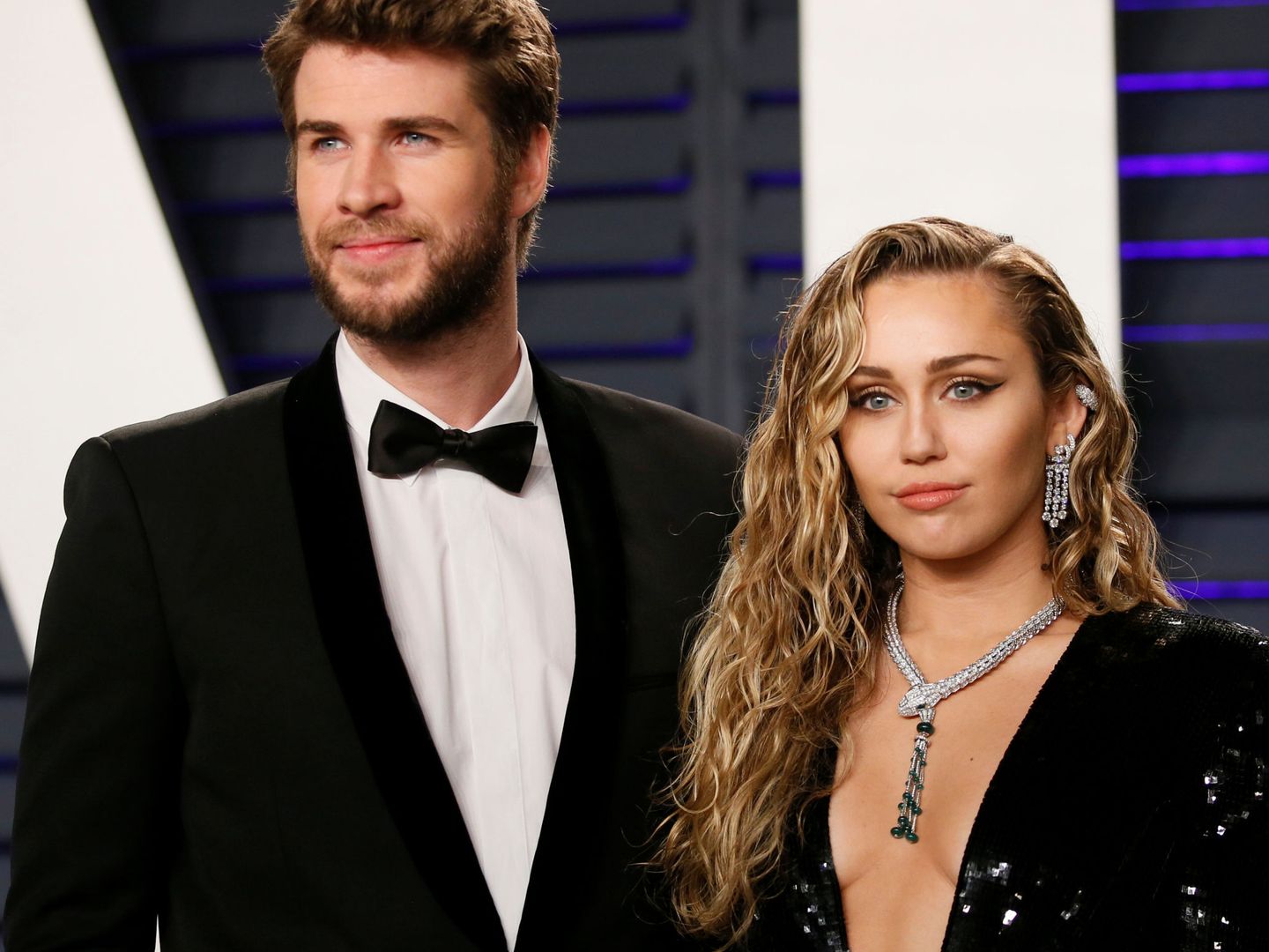 Miley Cyrus, con Liam Hemsworth. (Reuters)